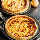 Traditional french pie. Quiche lorraine on kitchen table. - PhotoDune Item for Sale