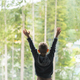 Young Boy Raising Hands Towards Forest View From a Window on a Bright Day - PhotoDune Item for Sale
