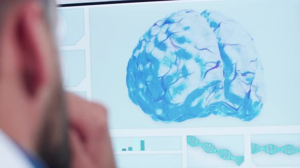 Close Up Shoot of Doctor Looking at 3D Brain Model alt