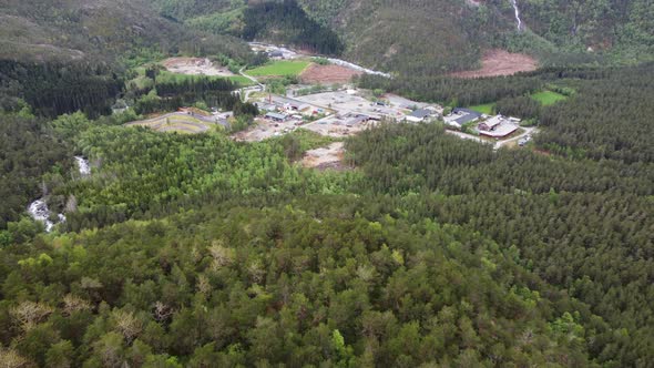 Secret industrial area hidden far inside the deep woods of Kinsarvik Hardanger - Aerial from mountai alt