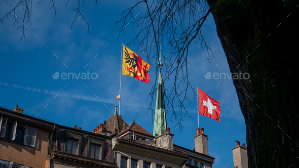 Flags of the canton of Geneva and Switzerland flying over St Peter's ...