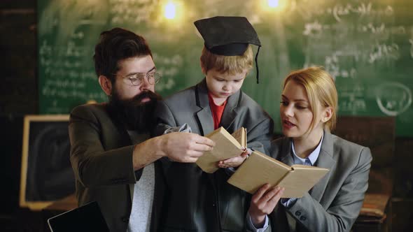 Distance Learning. Family Doing Homework Together at Home alt