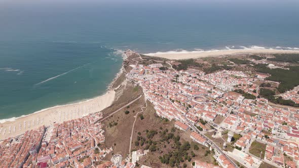 Panoramic of Nazare beach and town, Silver Coast, Portugal. Aerial view alt
