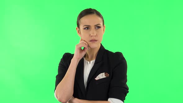 Young Girl Thinks About Something. Green Screen alt