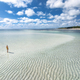 Aerial view of woman, sandbank in ocean, white sand, blue sea - PhotoDune Item for Sale