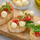 Round mozzarella, cherry tomatoes and microgreens on a piece of white bread, a healthy sandwich - PhotoDune Item for Sale