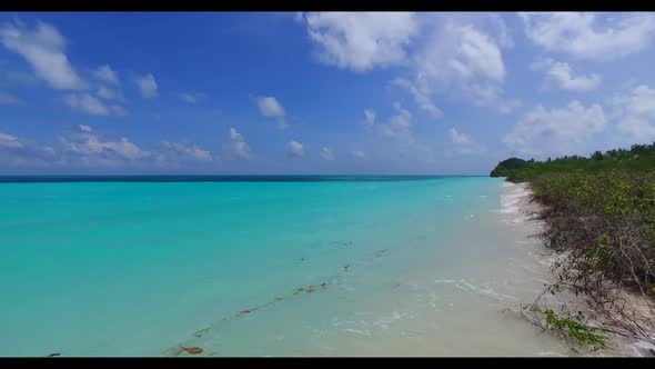 Aerial drone shot sky of luxury coast beach journey by blue green sea and white sandy background of  alt