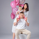 family: mom dad and child on a white background with the number one and balloons. Little girl&#39;s birt - PhotoDune Item for Sale