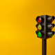 Mini traffic lights on a yellow background - PhotoDune Item for Sale