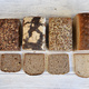 tin loafs of sourdough bread selection with cut slice - PhotoDune Item for Sale