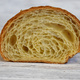 freshly baked croissant cut in half to show inside - PhotoDune Item for Sale