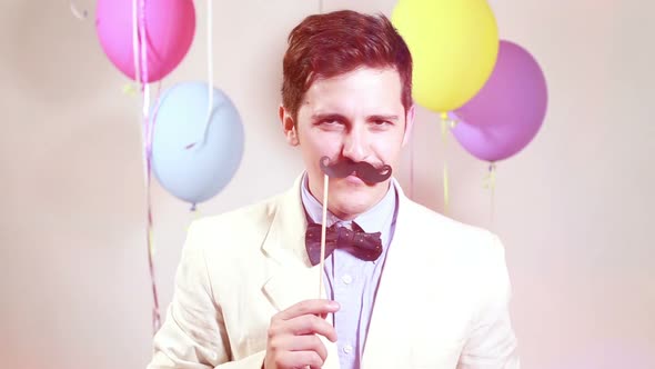 Close up portrait of man with moustache in photo booth alt