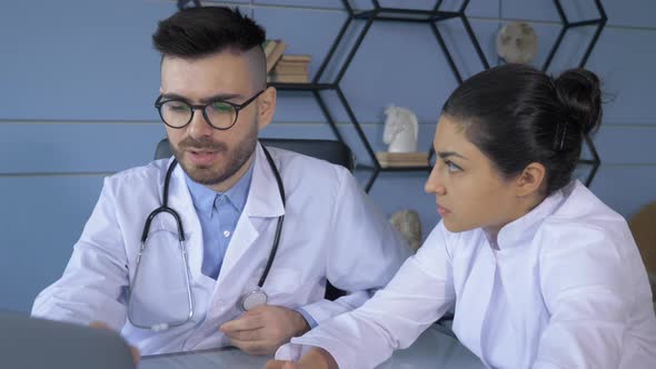 Close Up Medical doctors working in hospital office making computer research. Medicine alt