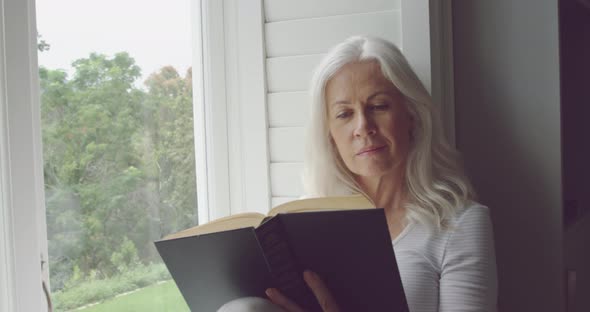 Senior woman alone at home alt