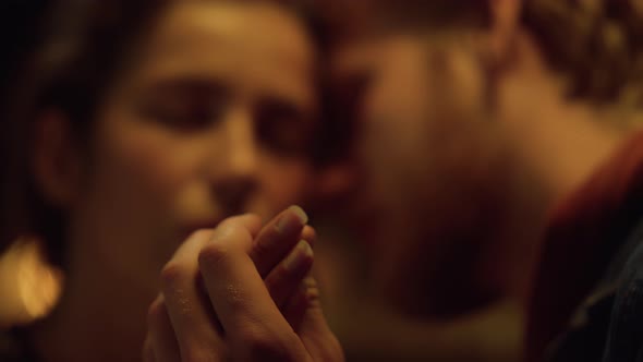 Lovely Couple Kissing Together on Romantic Evening Honeymoon Holiday Closeup alt