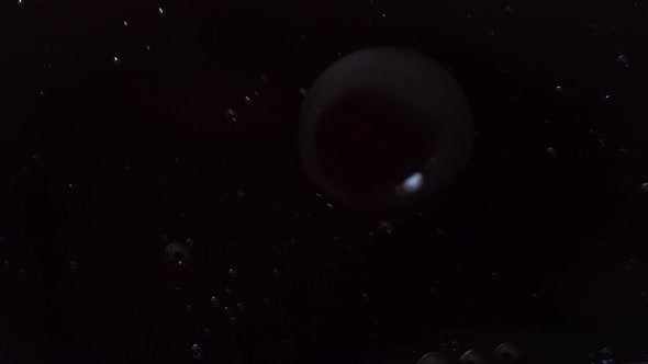 Bubbles Float In Oily Water With Black Background