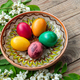 a basket with several eggs in it and white flowers on the side - PhotoDune Item for Sale