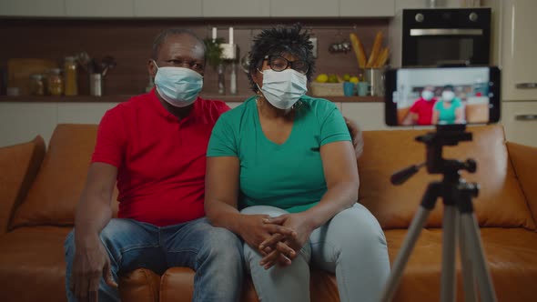 Sick Elderly Black Couple in Face Mask on Self Isolation alt