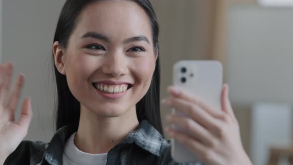 Happy Asian Korean Japanese Chinese Girl Smiling Female Face Woman with Mobile Phone Waving Hand alt