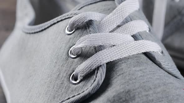 Man casual boots details close-up - Male shoes laces and snitches slow tilting alt