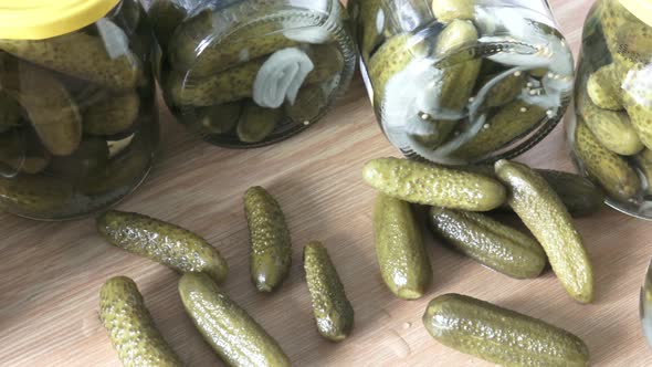 Glass jars with pickled cucumbers. Marinated pickled cucumbers.