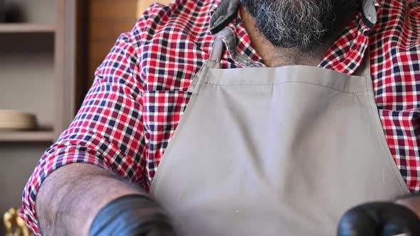 Chef Prepares Pilaf Pouring It with a Mixture of Water and Saffron alt