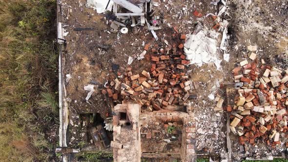 Remains of a Burnt House with a Chimney Protruding From the Ruins Aerial View alt
