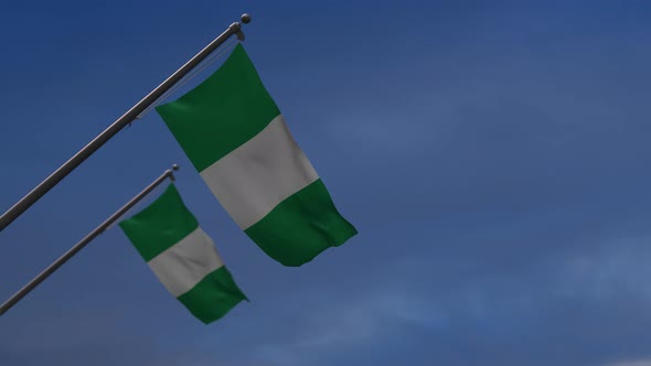 Nigeria  Flags In The Blue Sky - 4K
