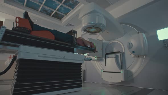 Patient Getting Radiation Therapy Treatment Inside A Modern Radiotherapy Room alt