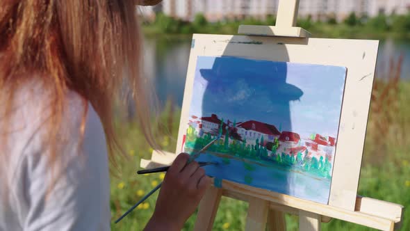 Painting on Plein Air is Creative Hobby and Relax in Weekend Woman Artist is Picturing Town alt