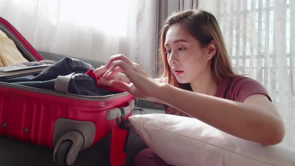 Woman serious checking before traveling the new normal travel need a face mask alt