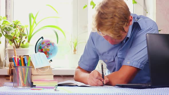 Teenager Communicates with Laptop in Quarantine alt