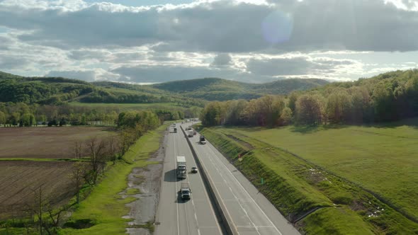 Aerial Above Drone View of Flight Over the Highway with Many Cars and Trucks alt