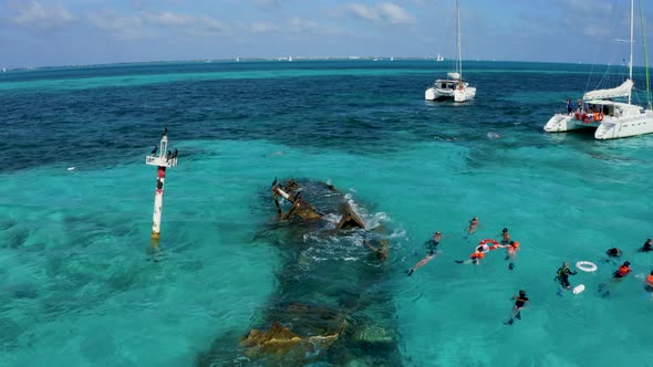 Aerial View of Snorkeling in the Caribbean Sea Near the Sinked Ship alt