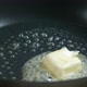 Butter Cube Melting And Sizzling In Frying Pan - VideoHive Item for Sale