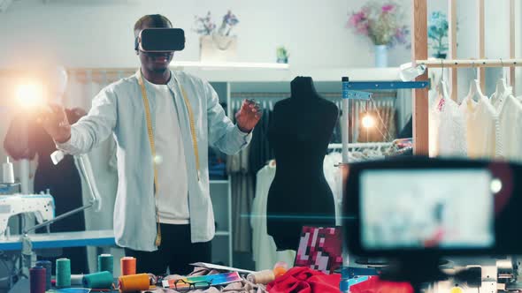 Afican Designer is Using VRdevice While Filming a Vlog alt