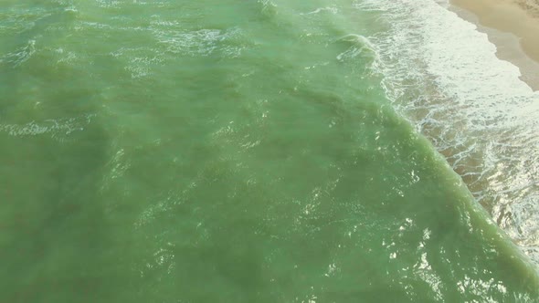 Aerial View. View From Flying Drone on Green Water with Waves in Azov Sea alt