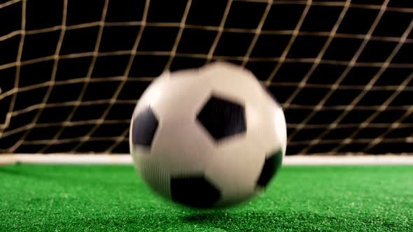 Close-up of football bouncing on artificial grass 4k alt