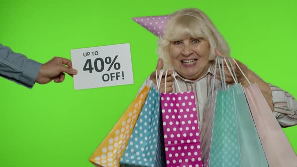 Inscription Up To 40 Percent Off Appears Next To Grandmother, Woman Celebrating with Shopping Bags alt