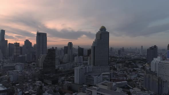 4k Aerial city view of Bangkok dowtnown, Flying over Bangkok, Thailand. alt