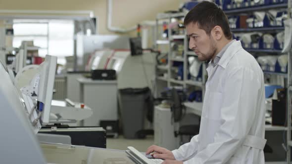 Asian Worker on SMT Factory alt