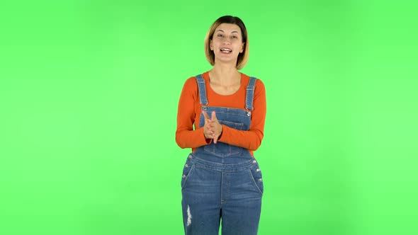 Beautiful Girl Is Reporting and Tells a Lot of Interesting Informations. Green Screen alt