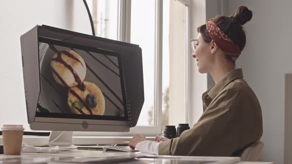 Photographer Editing Food Pictures on Computer alt