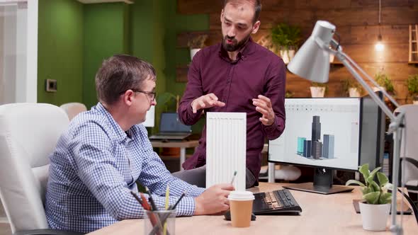 Two Architects in Cozy Office Talking About New Buildings Architecture alt