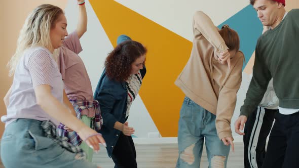 Slow Motion of Creative Youth Chilling in Dance Studio Moving Bodies and Arms alt