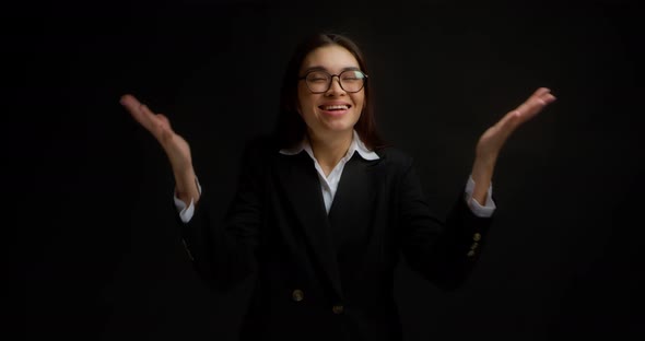 Happy Business Lady Stands with Her Palms Raised and Smilesit Finally Happened