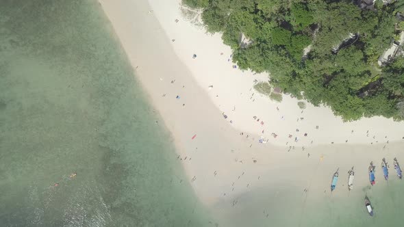 Aerial view of sunbathing swimming people relax on Phra Nang beach. Thailand