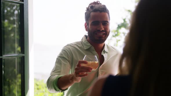 Group of friends toasting drink glasses alt