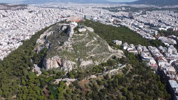 Shooting with a Drone Flying Around Mount Lycabettus in Sunny Weather