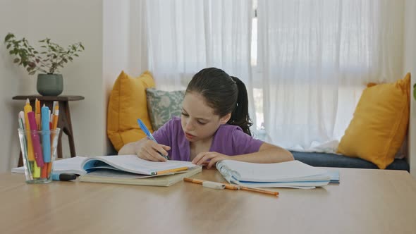 Frustrated young girl trying and failing to prepare homework for school alt